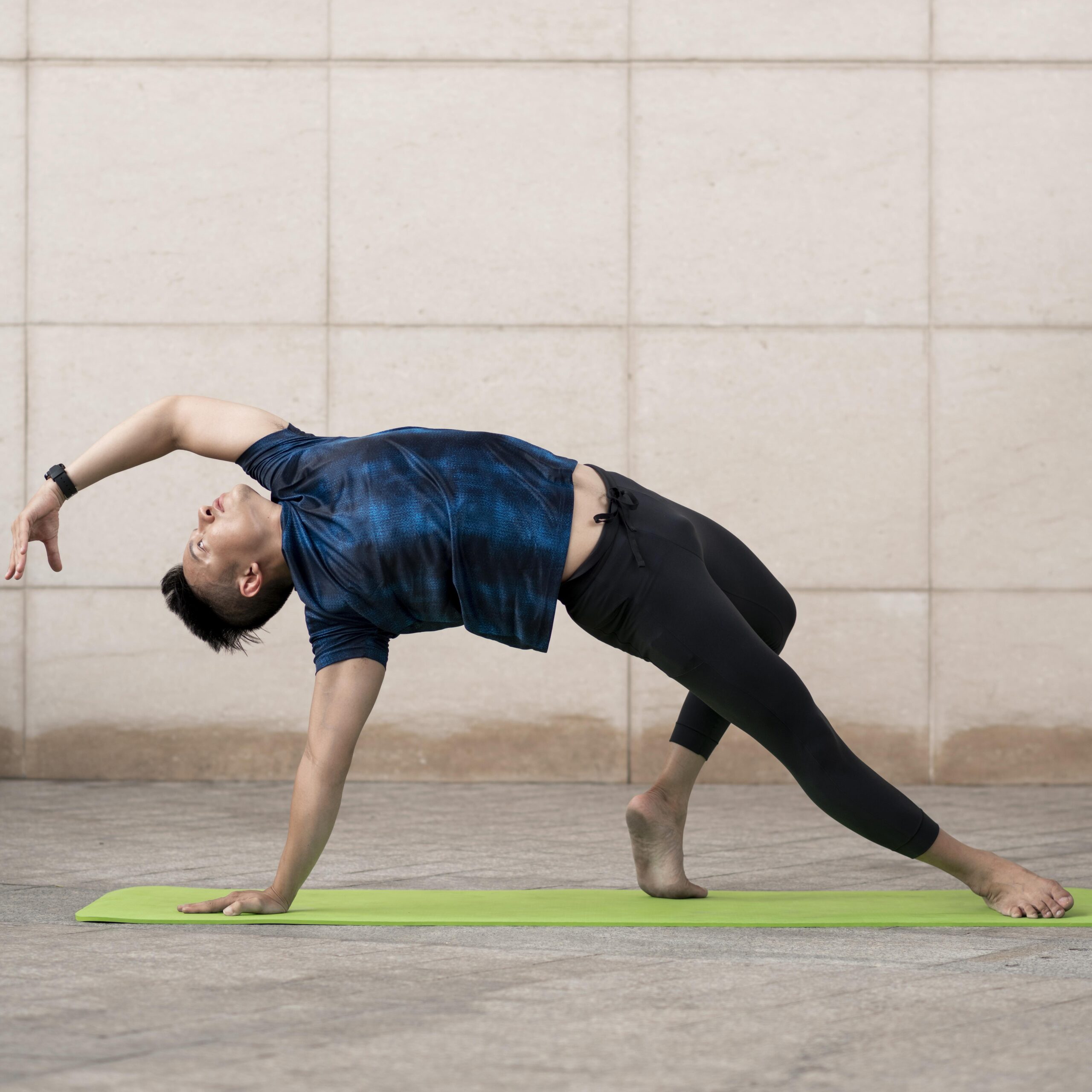 man doing yoga outside mat with copy space scaled